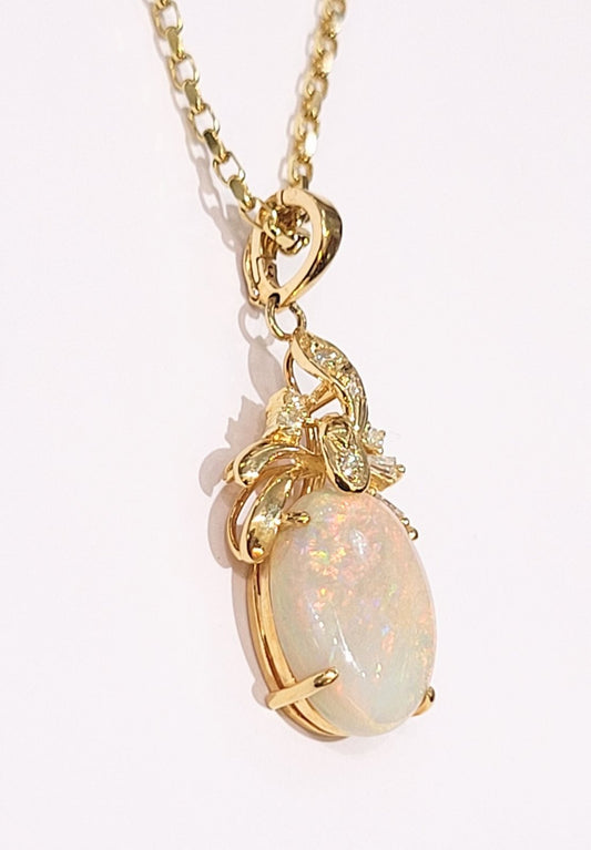 Yellow Gold Australian Fire Opal and Diamond Pendant. 14k ,3.8gr, Opal: Oval Shape 16x12.1x3mm 2.9ct.TDW: 0.15ct