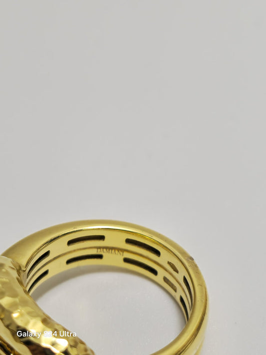 Italian Damiani knot Style Wide Ring with a Small Diamond on the shank. 18k