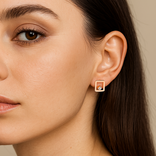 18K Framed Light: The Rose Gold Illusion Studs Earrings Set with one Round Diamonds. TDW: 0.02ct