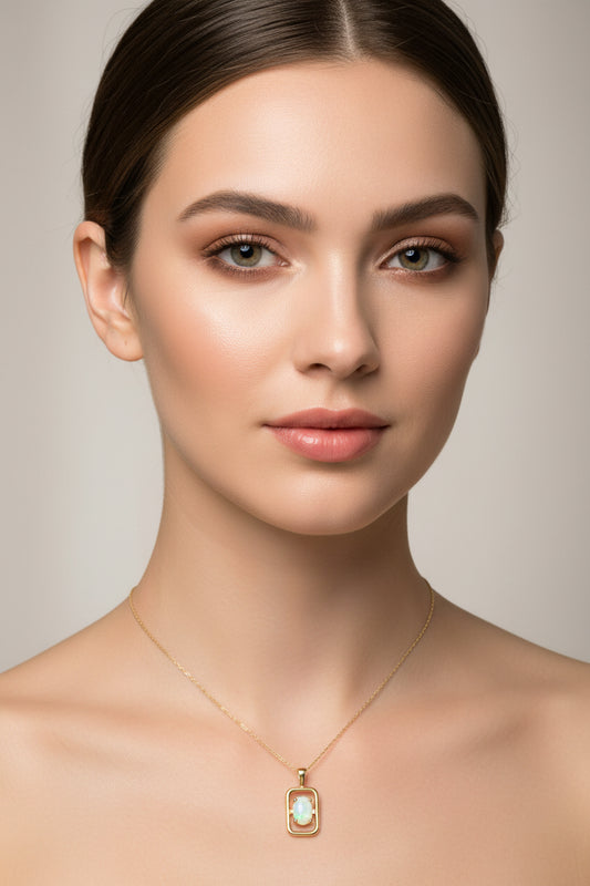 Yellow Gold Oval Opal Solitaire Pendant in a Rectangular Open Frame Design, 14k O:0.22ct