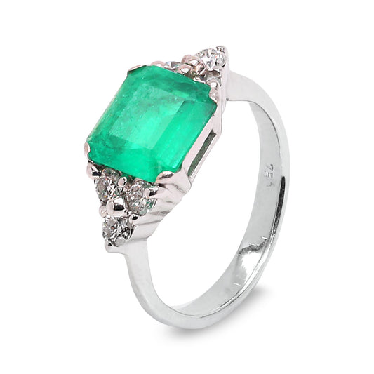 White Gold Emerald Cut Natural Emerald and Diamond Ring. 18k 4.2gr E: 8.8x8.24x3.3mm 1.6ct. Medium Green SI 6 Round Diamonds. TDW: 0.24ct. SI GH