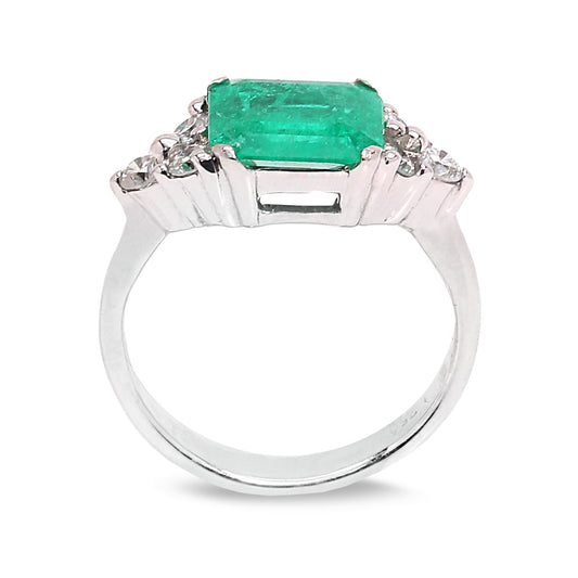 White Gold Emerald Cut Natural Emerald and Diamond Ring. 18k 4.2gr E: 8.8x8.24x3.3mm 1.6ct. Medium Green SI 6 Round Diamonds. TDW: 0.24ct. SI GH