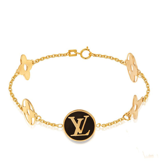 Yellow Gold Station Bracelet with Flowers and Clover. 18k 4.4gr 7 1/2"