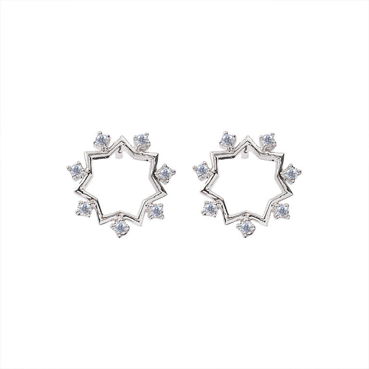 White Gold Earring  Star design setting with seven Diamonds TDW: 0.0.23ct14k