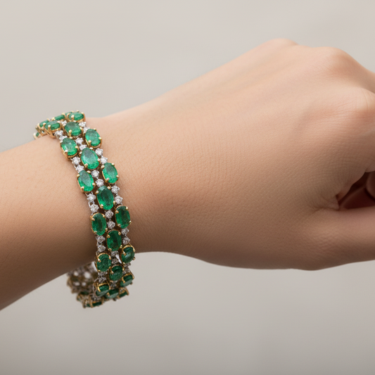 18k White and Yellow Gold Oval Emerald & Diamond Tennis Bracelet