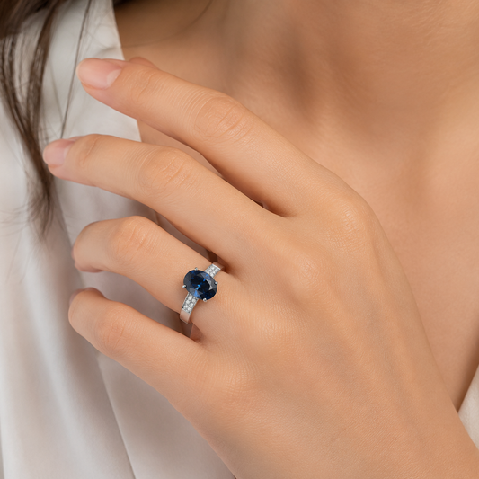 10K White Gold Oval Blue Topaz and Diamond Ring