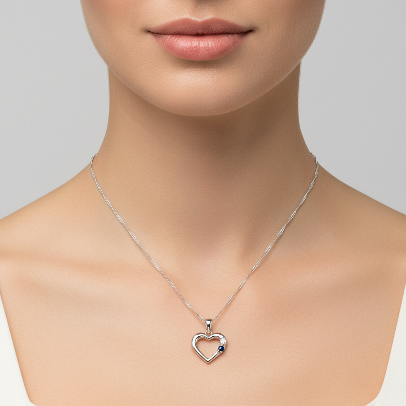 10K White Gold Chain and Heart Pendant setting with one Diamond and a Sapphire S: 0.05ct