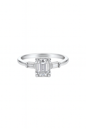 Vintage White Gold Solitaire Diamond Ring with an Emerald Cut Natural Diamond in Centre and Two Baguettes on Sides. 18k TDW: 0.57ct VS2 GH