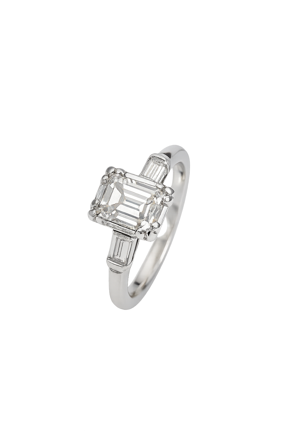 Vintage White Gold Solitaire Diamond Ring with an Emerald Cut Natural Diamond in Centre and Two Baguettes on Sides. 18k TDW: 0.57ct VS2 GH