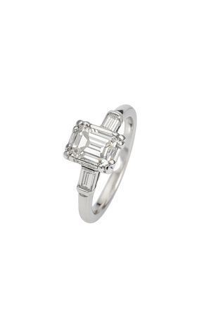 Vintage White Gold Solitaire Diamond Ring with an Emerald Cut Natural Diamond in Centre and Two Baguettes on Sides. 18k TDW: 0.57ct VS2 GH