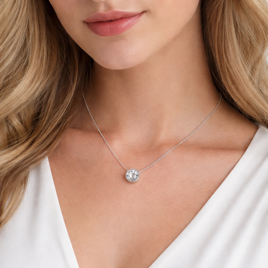 White Gold Floating Bezel Set Solitaire 0.68ct Diamond Necklace. 18k, 2.3gr, 0.68ct, SI, G. 18" Full Adjustable Chain