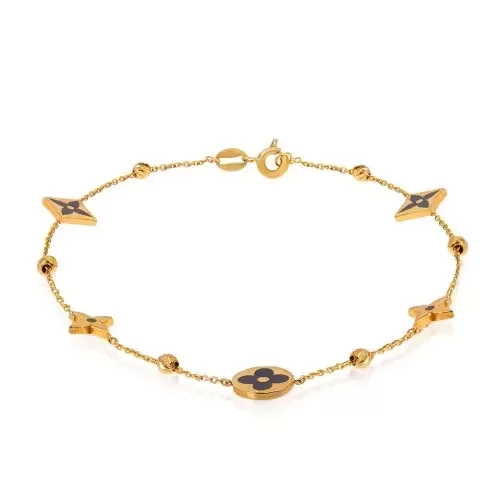 Yellow Gold station Bracelet with flowers in black enamel and gold balls.
