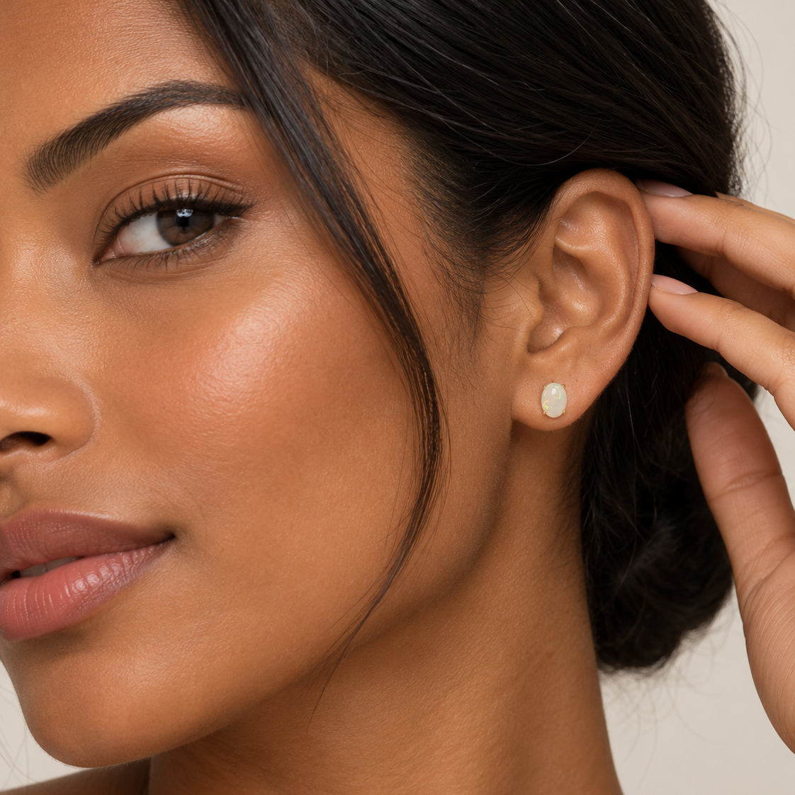 14K Yellow Gold Natural Opal Stud Earrings - worn on model, ear close-up