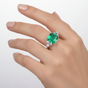 18K White Gold Emerald Cut Natural Emerald and Diamond Ring. E: 1.60ct. TDW: 0.24ct. SI GH
