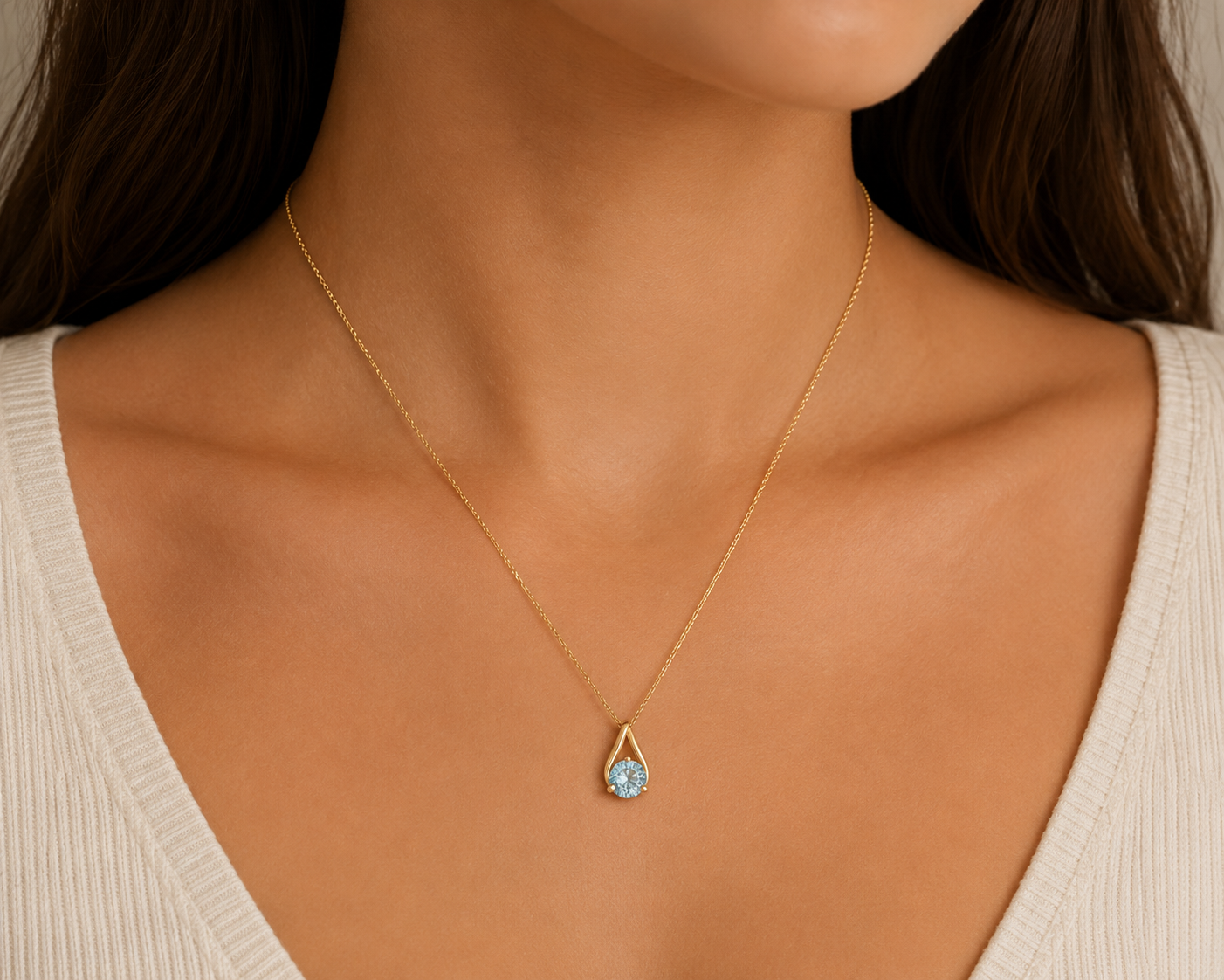 10K Yellow Gold Teardrop Shape Pendant with Blue Topaz.