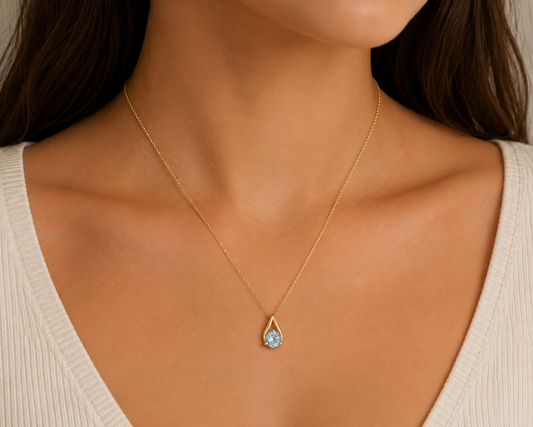 10K Yellow Gold Teardrop Shape Pendant with Blue Topaz.