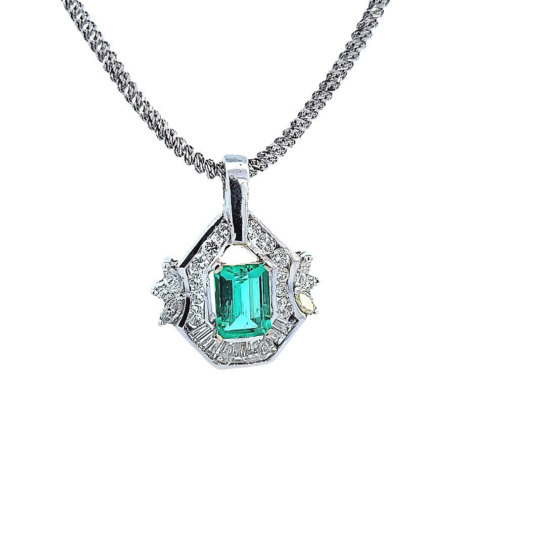 White Gold Classic Octagonal Columbian Emerald and Diamond Pendant. E: Medium Green AAA 9.2x6.8x4.2mm 1.82ct. Diam: 14xRound Cut 9x Baguettes 4xMarq. TDW: 1.46ct VS-SI1 GH. 18k 7.01gr