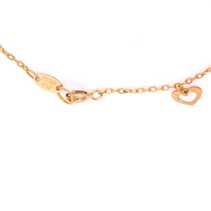 Yellow gold station bracelet with white and yellow gold heart, 18k, 6 1/2 Inches, 1.62gr