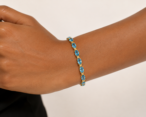 14K Yellow Gold Oval Blue Topaz Tennis Bracelet