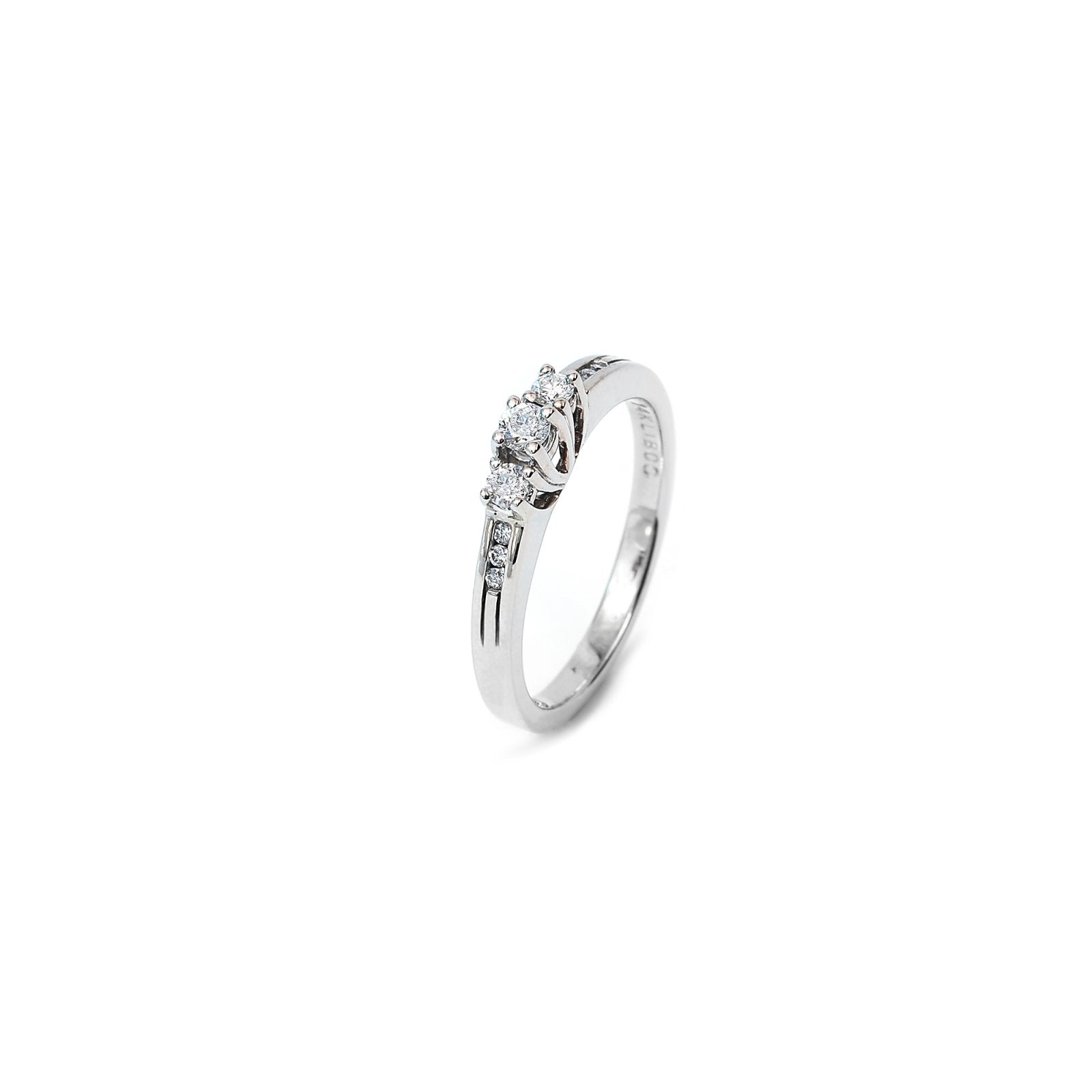 White Gold Diamond Ring with Three Round Diamonds on Top and 6 Smaller ones on Shanks and one diamond on Internal Part of Shank. TDW: 0.25ct VS FG 14k 3.3gr