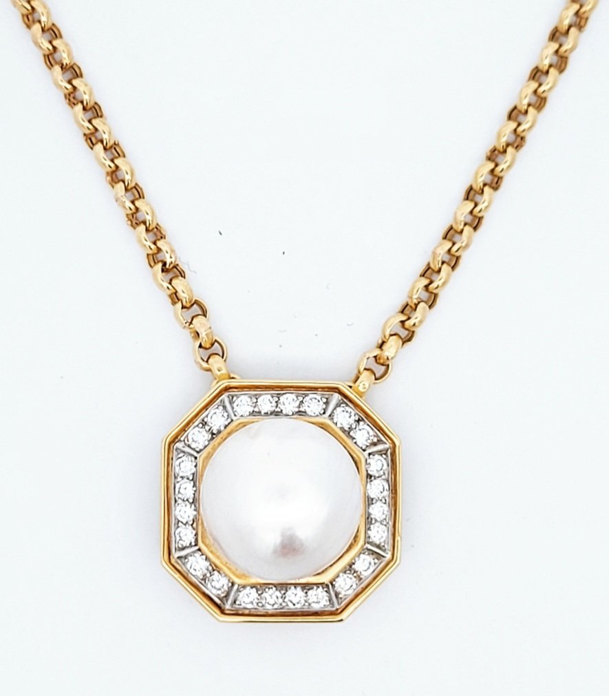 Yellow Gold Pearl and Diamond Pendant. Octagonal Shape, 24 Round Diamonds. 18k,  11.6gr. Pearl: Dome shape Saltwater Pearl, 15.3mm. TDW: 1.2ct VS FG .