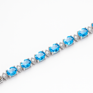White Gold Blue Topaz and Diamond Bracelet. 18k, T: 13.5ct. TDW: 0.54ct, VS, FG